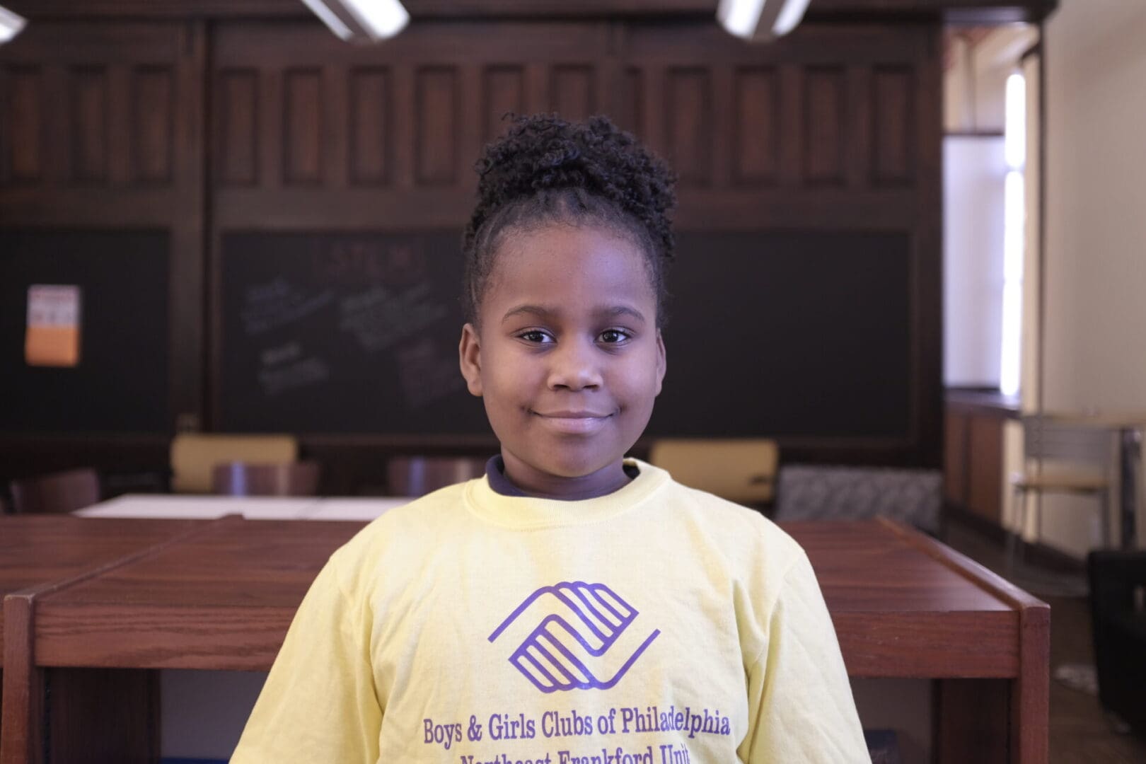 A little girl in a yellow shirt