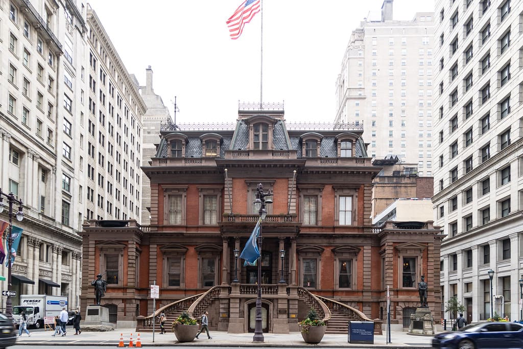 Historic urban building with American flag.