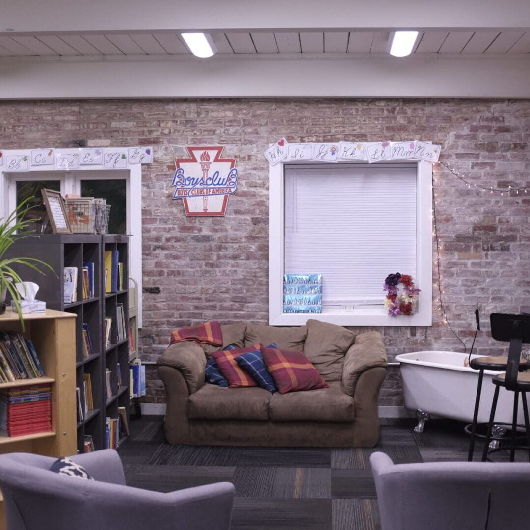 A room with couches and bookshelves